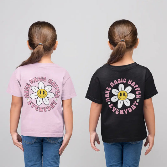 Two children wearing t-shirts with the text make magic happen everyday around a retro flower design