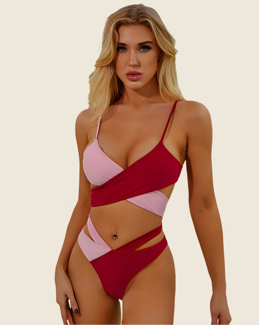 Woman wearing a red and pink bikini against a beige background