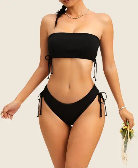 Black bikini set worn by a model on a beige background