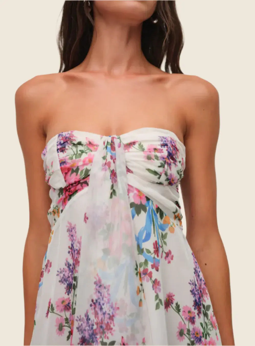 Floral strapless dress on a plain background