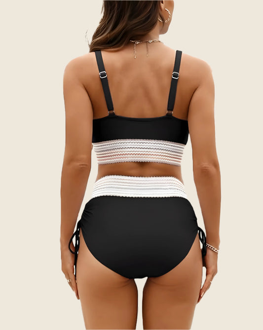 Black and white bikini set on a beige background