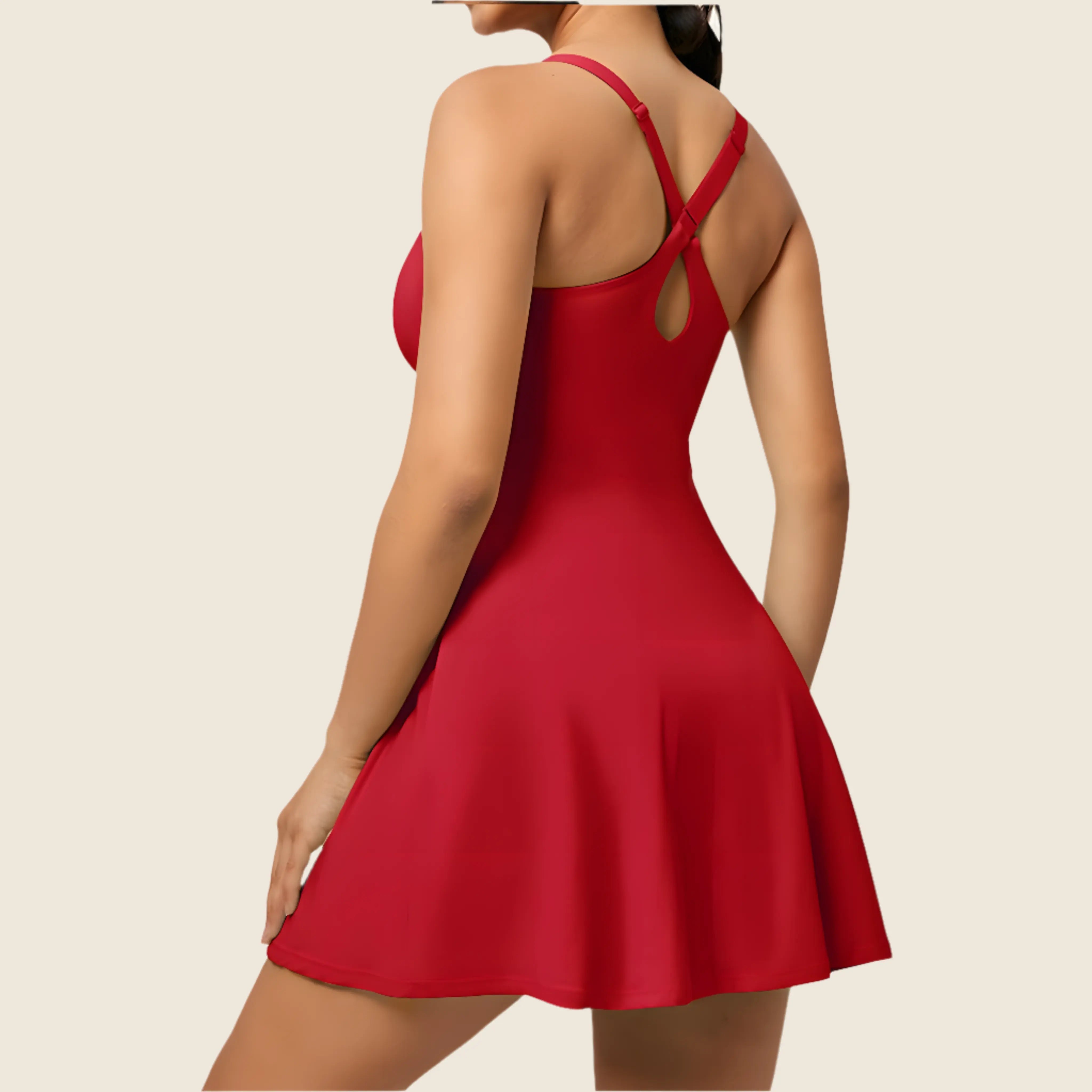 Red dress with thin straps on a beige background