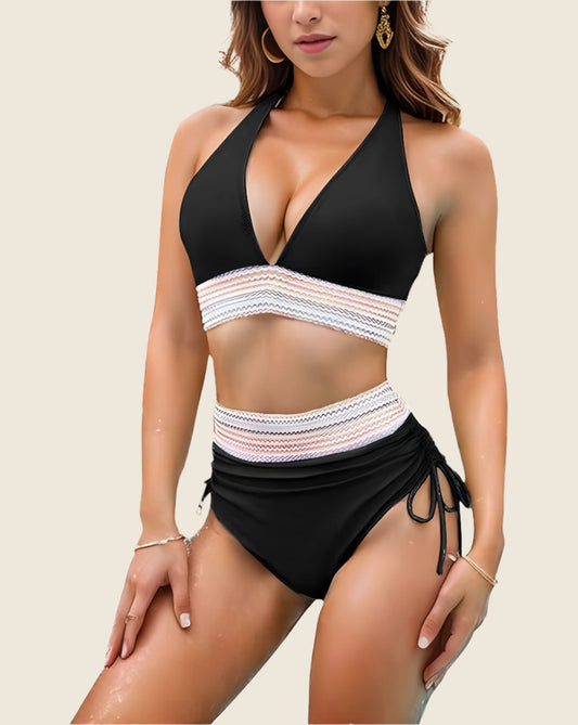 Black bikini with white lace details on a beige background